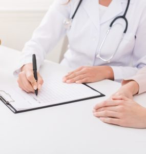 Nutritionist explaining personalized diet plan for patient during appointment in clinic, copy space